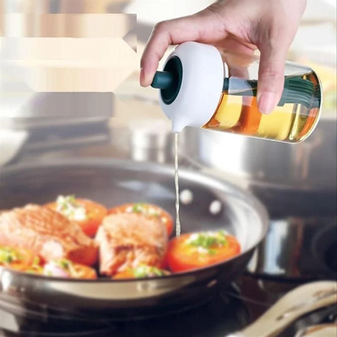 Compact oil dispenser with built-in silicone brush for spreading oil, sauces, and condiments